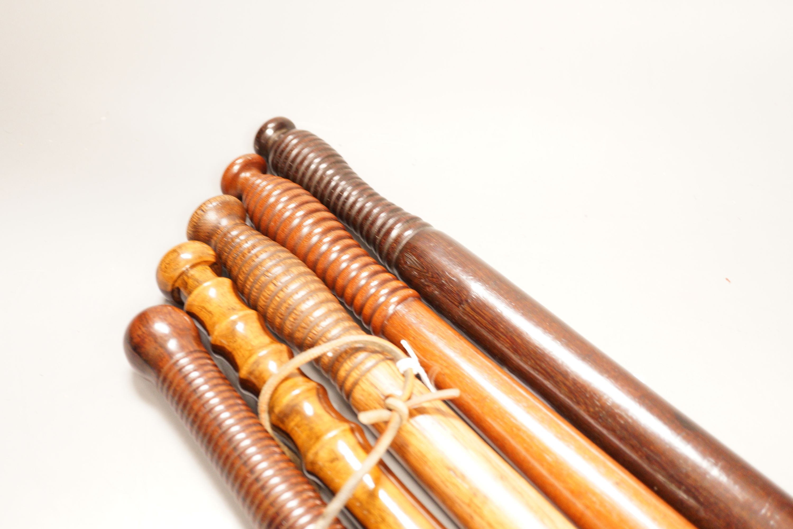 A collection of five assorted 19th century constabulary truncheons in varying woods